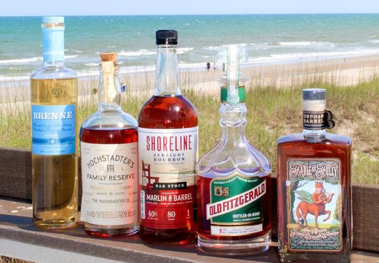 whiskey bottles by the beach